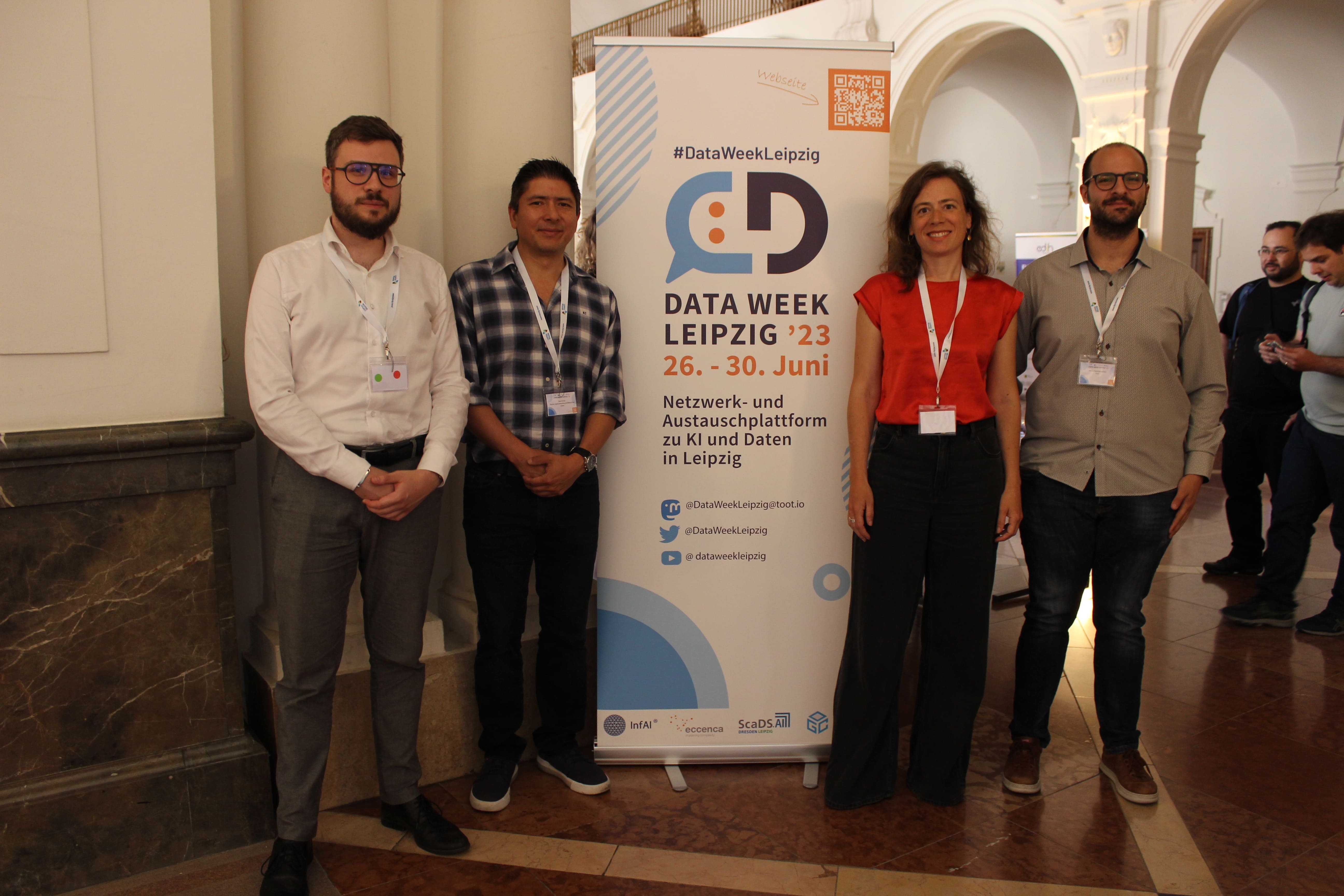 Visitors in front of the DataWeek banner